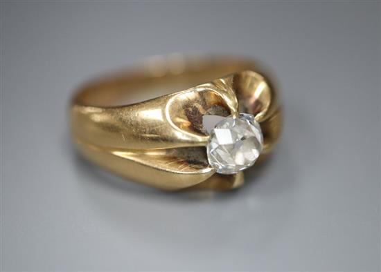 An early 20th century yellow metal and claw set solitaire diamond ring, size N, gross 7.1 grams,